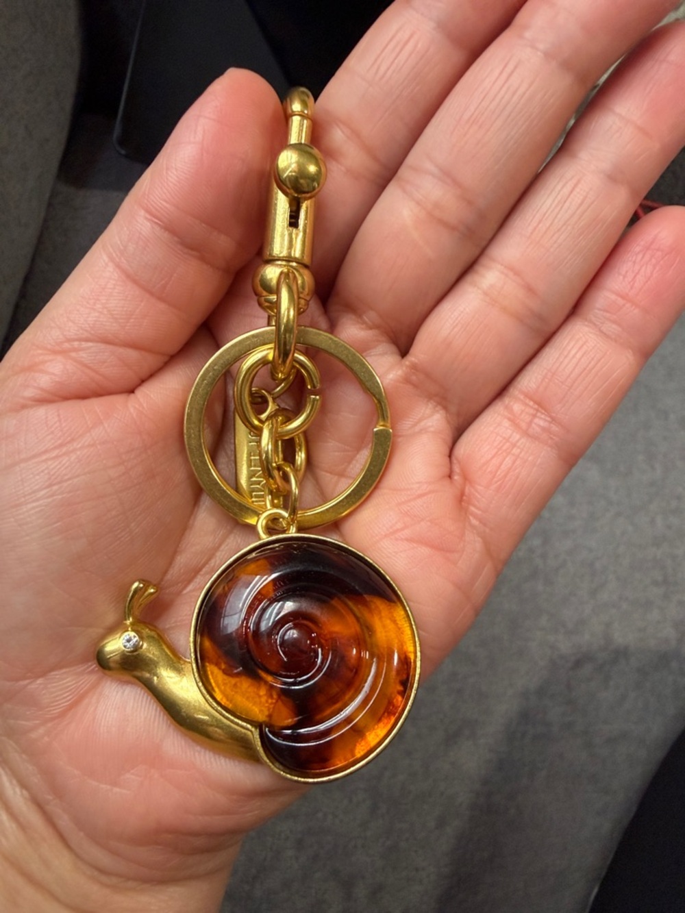 Gold-tone Snail Keychain with Amber Swirl